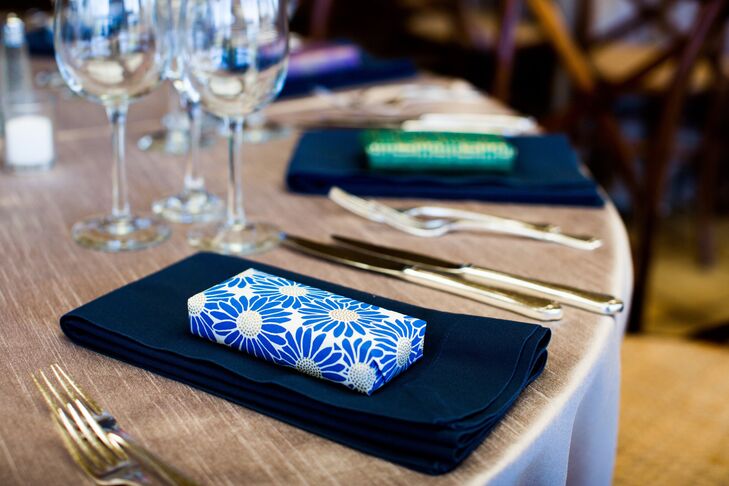 The favors were wrapped in colorful paper and placed on the napkins at each place setting.