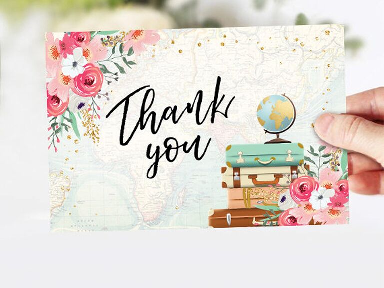 'Thank you' in black calligraphy with pink floral details and globe and luggage graphics on faded map background with gold flecks