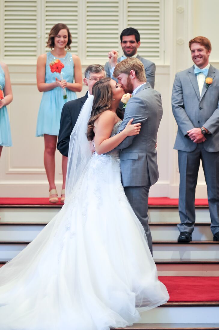 Candace went into a bridal boutique not knowing what dress she wanted, but left that day with a gorgeous dress. The classic white Sophia Tolli ball gown had a chic overlay covered with silver beading and some light ruching below the sweetheart neckline. “I loved it so much, it was so hard to take off,” Candace says.