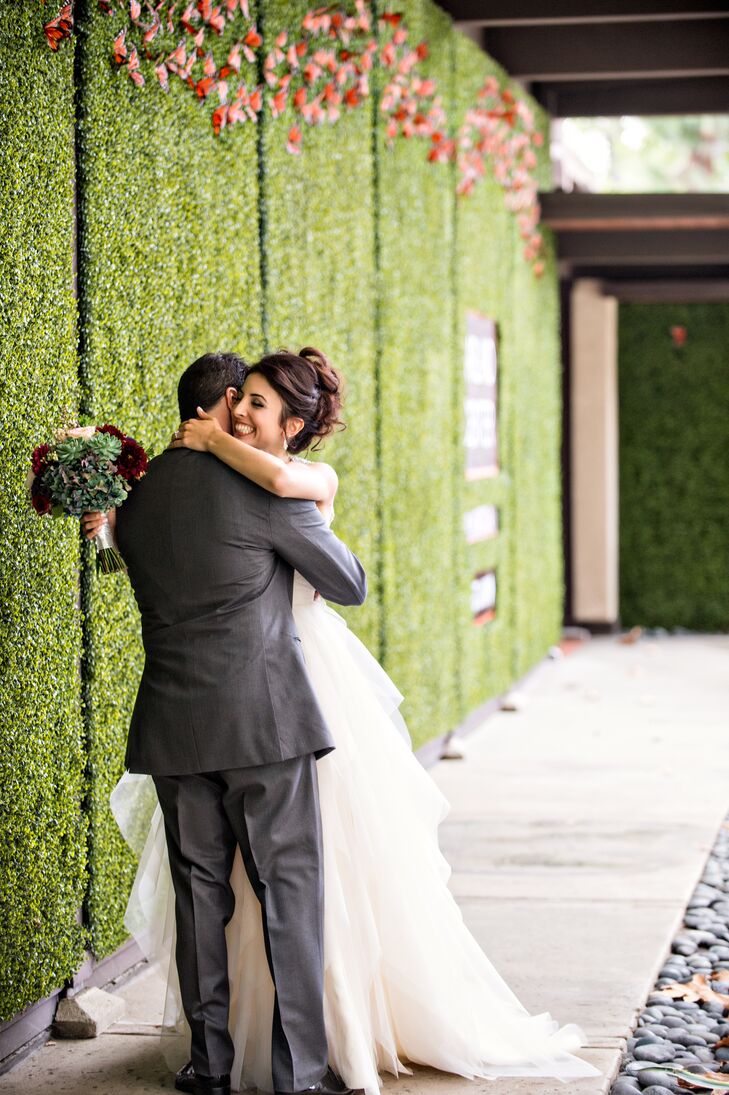 Before the day’s festivities unfolded, Lauren and Phil took a moment for themselves, meeting in the Garland's courtyard for a first look. Lauren knocked Phil’s socks off with her floaty Haylay Paige Carrie ball gown, while Phil wowed her in his sharp gray Vera Wang suit.