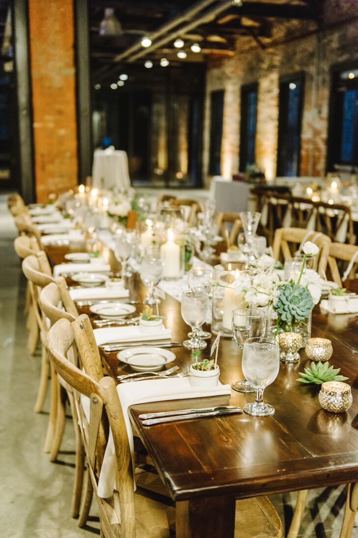 The reception took place inside the Mount Washington Mill Dye House, where guests took their seats at long wooden farm tables decorated with succulents and candles.