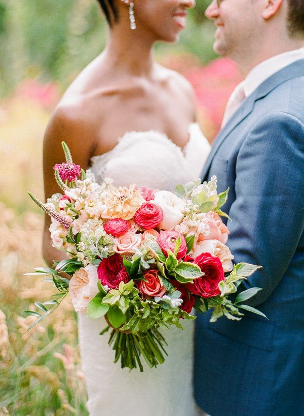Couple hugging and holding bouquet