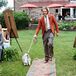 Gina’s brother stood out as her man of honor during the processional in a casual orange suit jacket from Suitsupply. He also sported gray pants, a white shirt and their grandfather's orange-striped tie. How sweet is that? Of course, Gina and Mike also wanted their pets to be a part of the ceremony, so her brother walked their canine ring bearer, Maverick Jay, down the rug-lined aisle.