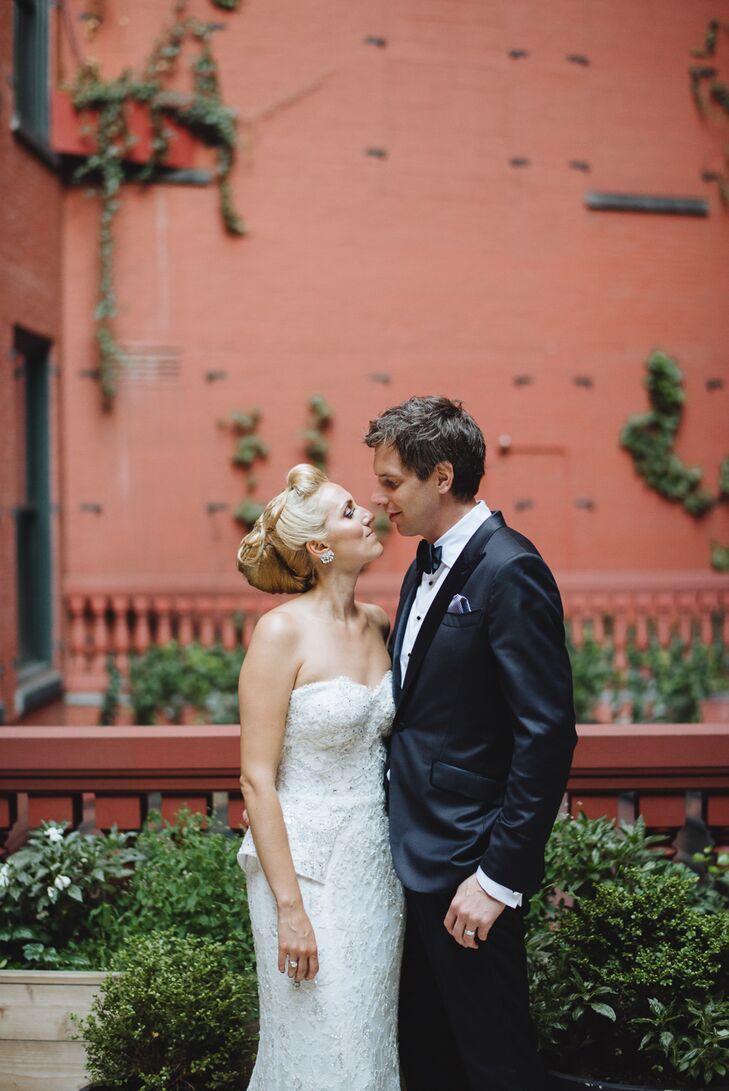 Whitney and Ryan pulled out all the stops when it came to their wedding day attire, setting a chic, formal tone for the evening’s festivities. Whitney walked down the aisle in a Monique Lhuillier gown, a striking sheath design with allover embroidery and a peplum detail. Ryan took the traditional route and rocked a classic black tuxedo with a black bow tie and silver pocket square.