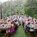 Market lights were strung over the 12 farm tables, which were left bare for a relaxed touch. "We let the flower and paper goods make the color statement," Kimberly explains.