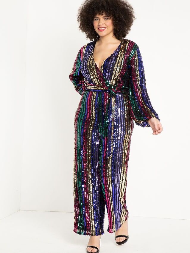 Model wears a striped sequin jumpsuit. 