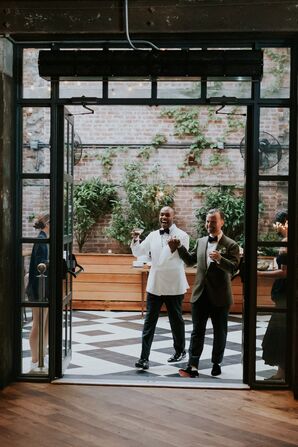 Grooms in Green and White Jackets Walk into Industrial, Vintage-Inspired Reception
