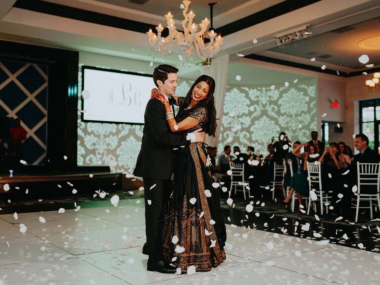 couple dancing at wedding in sari and tux