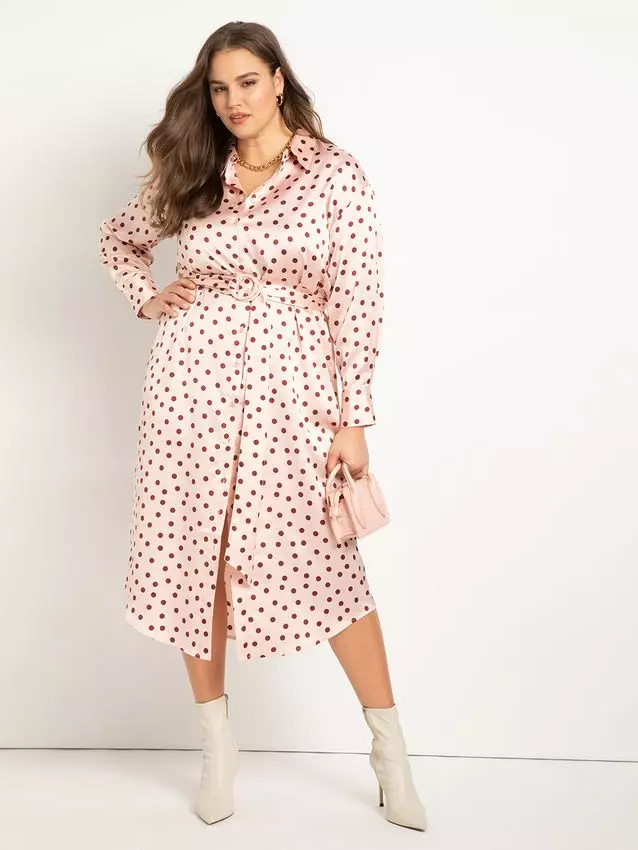 A model shows off this flirty polka-dot shirt dress.