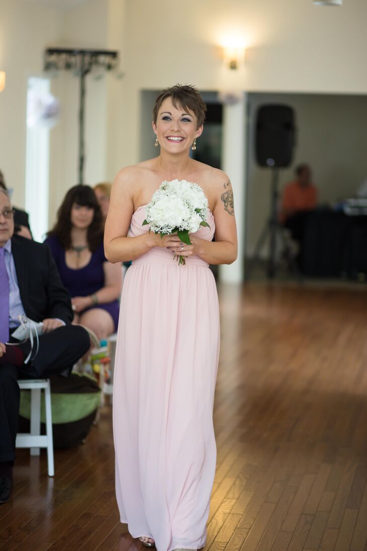 Mandy's maid of honor wore a strapless, blush dress from LuLus.com, while carrying a white hydrangea bouquet matching the other flower arrangements displayed throughout the wedding.