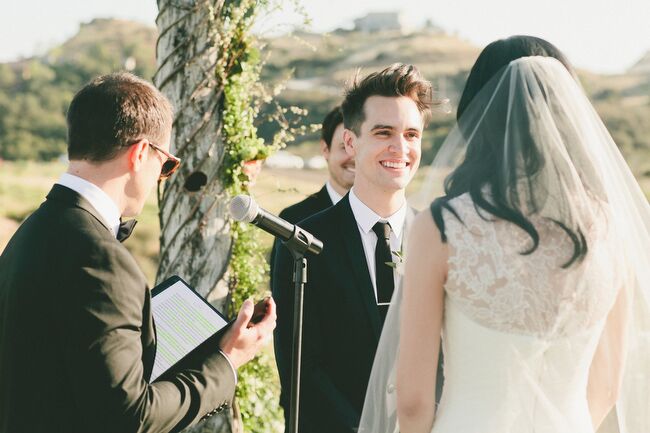 Saddlerock Ranch’s Chateau Le Dome offered the ideal backdrop for Sarah and Brendon’s wedding with its beautiful scenery and breathtaking views. The couple exchanged vows under a garland of vines, greenery and bright pink peonies. White pillar candles lined the aisles, adding warmth and ambiance to the hilltop setting.