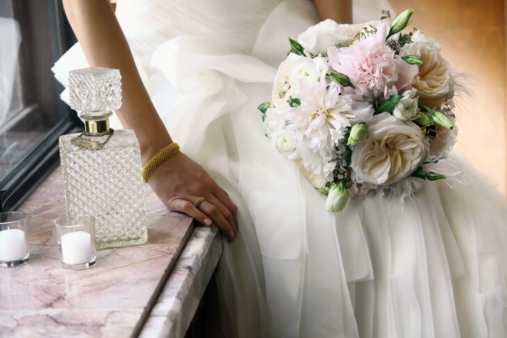 Katie carried garden roses, peonies and ranunculus in her neutral blush and white bouquet.