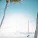 Before sitting down to dinner, guests enjoyed cocktail hour on the beach. Drinks were served at a bar setup inside a sailboat along the water, playing up the day’s beachy, nautical theme.rn