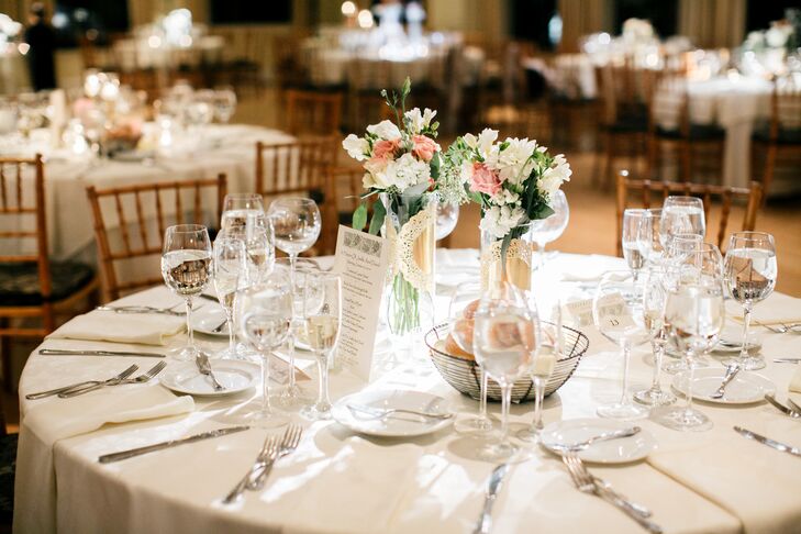 Centerpieces consisted of a variety of springy floral arrangements, included vases of pink roses and white freesias.