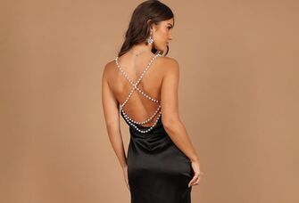 black open back satin dress with pearl straps