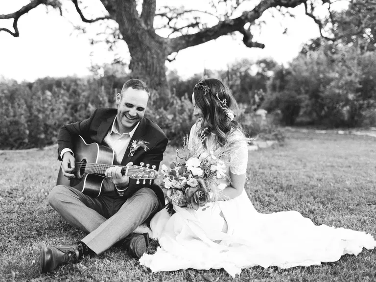 Groom Playing Guitar for Bride at Outdoor Elopement