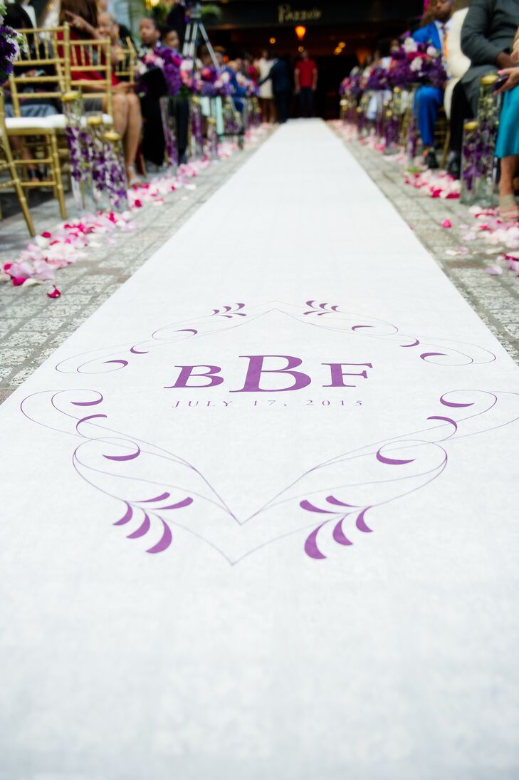 The aisle was lined with pink and white rose petals and featured a custom monogrammed runner.