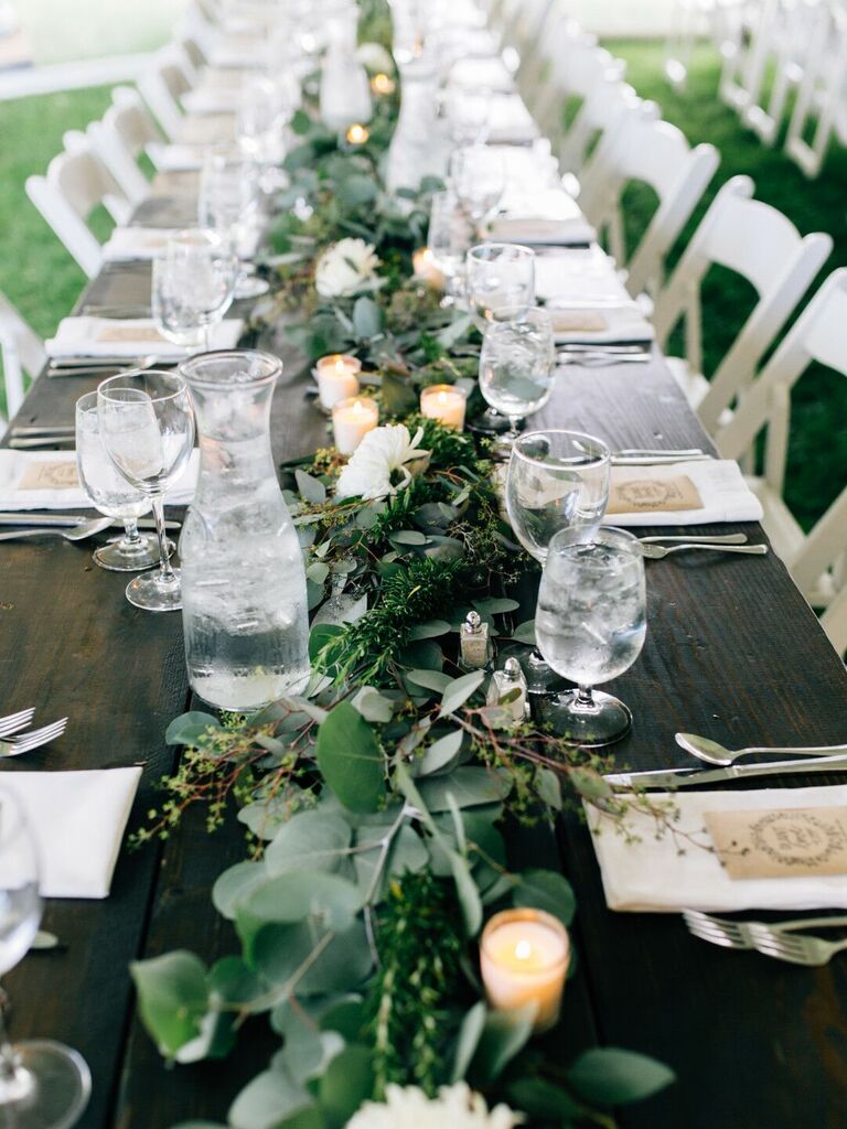 Greenery centerpiece at an outdoor wedding. 