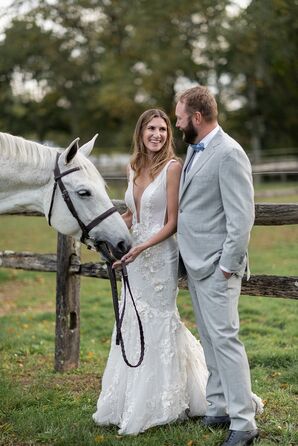 Bride and Groom in Formal Attire on a Ranch With the Bride's White Horse