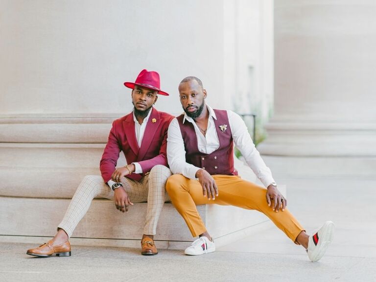 couple in orange and burgundy clothes for engagement session