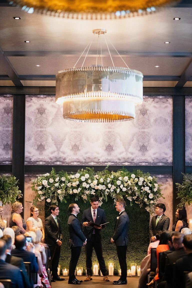 Ballroom wedding ceremony with silver chandelier