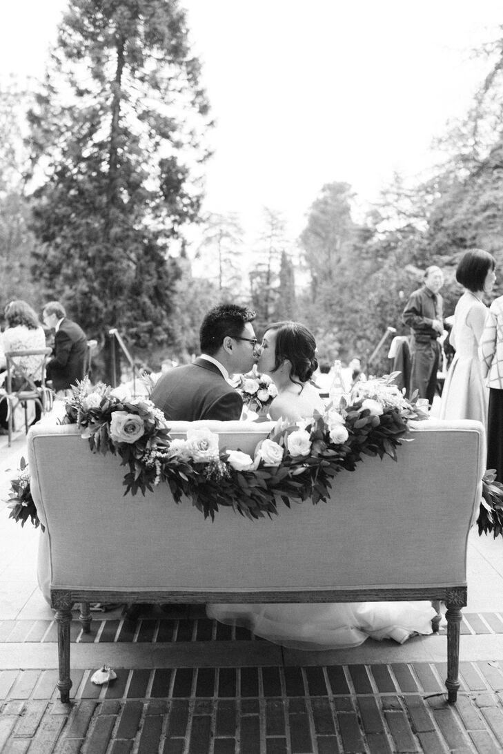 During dinner at Montalvo Arts Center in Saratoga, California, Jauchy and Jeffrey sat on a love seat draped with a lush floral garland.