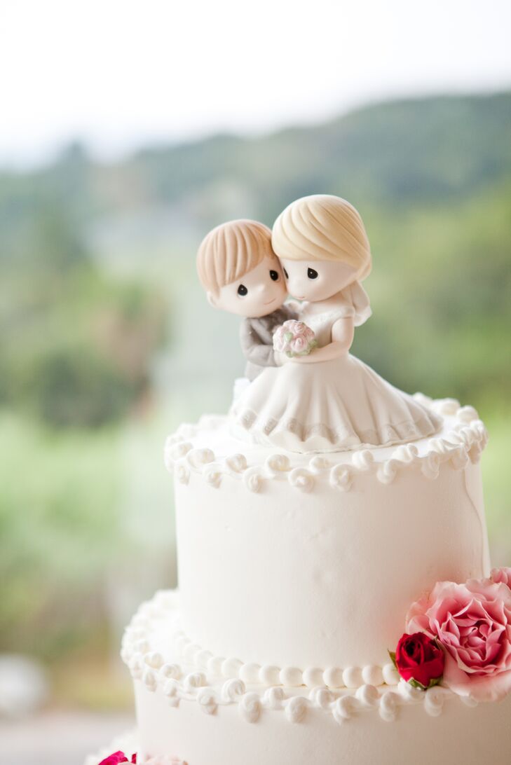 Kelley and Jeff chose a tiered, strawberry shortcake wedding cake covered in vanilla buttercream frosting. For the topper, they went with newlywed Precious Moments figurines that are sure to be a sweet keepsake.