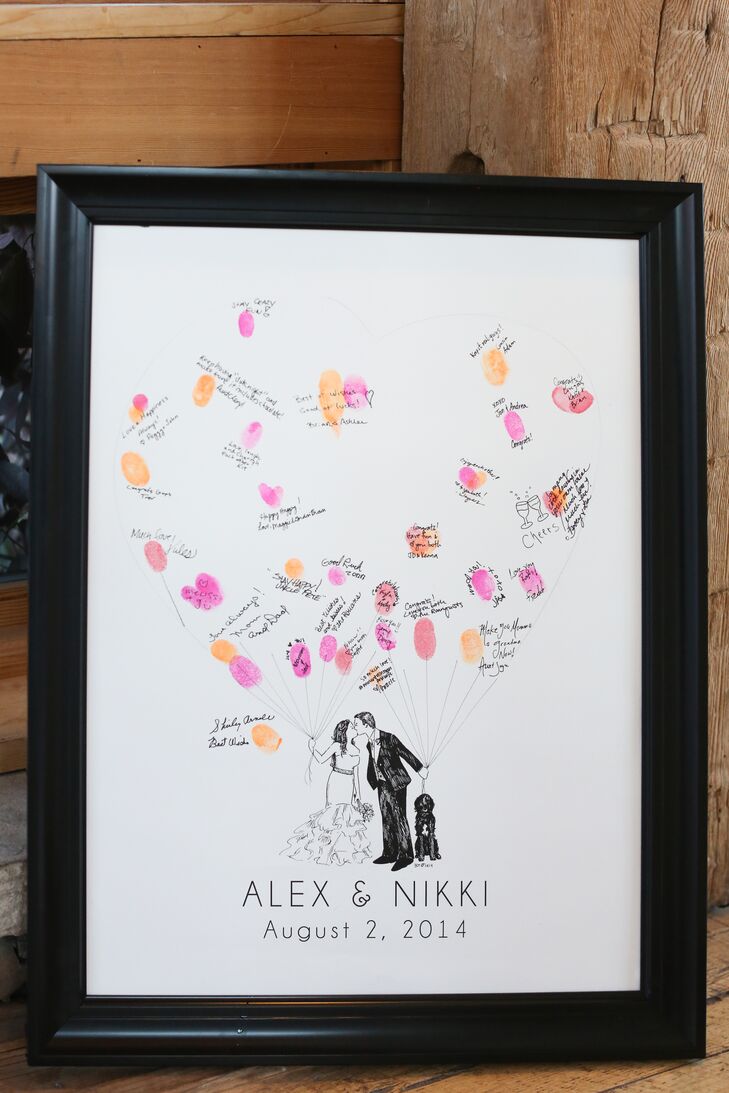 Guests left their fingerprints and well wishes on a custom sign-in board with an illustration of the couple and their dog Charlie. The fingerprints formed the outline of colorful bunches of balloons.