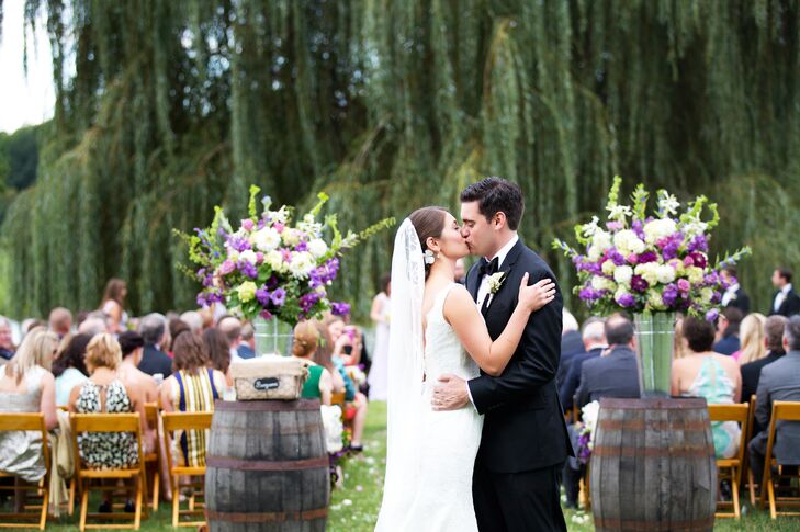 A picture-perfect ceremony took place under a willow tree, overlooking the pond and vineyards at Trump Winery.