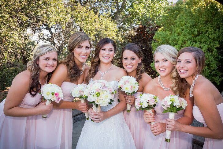 "The bridesmaid dresses, designed by Bill Levkoff, were light pink chiffon, knee length and had a sweetheart neckline," Marisa says. "For shoes, I let the girls decide on their style, but the colors consisted of gold and nude. For accessories, the bridesmaids wore chunky pearl necklaces with tiny rhinestones intertwined."