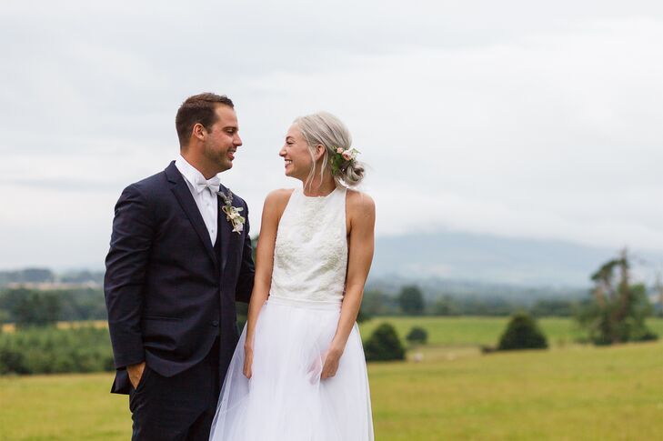 Elizabeth switched her look for the reception, donning an embellished white silk and Chantily lace jumpsuit with a tulle skirt overlay that she had designed herself. She teamed the look with rose gold Sophia Webster heels and a Vince Camuto cocktail ring.