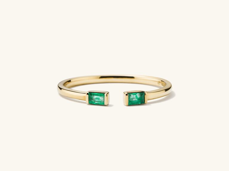Dainty emerald engagement ring by Mejuri. 