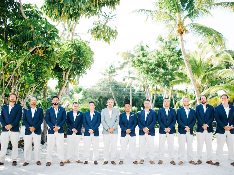 Groomsmen wearing matching navy jackets. 