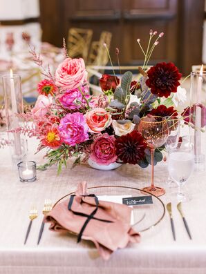 Place Setting With Blush Velvet Napkin Beside Dahlia Centerpiece