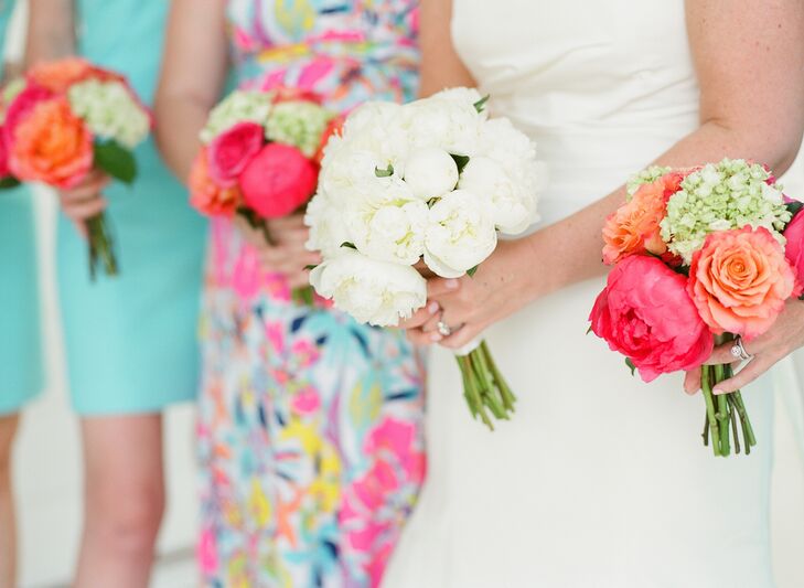 The bridal bouquet was a simple yet elegant full bunch of white peonies. The bridesmaids carried bright bouquets of ranunculus, hydrangeas, roses and peonies.