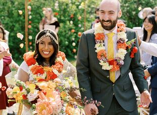 Vibrant tangerine, dark teal and dusty sage green set the scene at Tila and Jake’s private residence wedding in <a href="https://www.theknot.com/conte