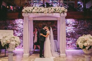 Stately Columned Chuppah with White Floral Garland