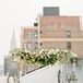 Mia and Jake’s chuppah perfectly reflected the couple’s modern, romantic vision with its fusion of natural and contemporary elements. Curly willow branches and Plexiglas columns served as the base for the striking structure, while a cascading garland of green amaranth, greenery, vines and blush and ivory blooms brought a secret-garden feel to the decor.