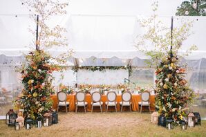 Tented Reception With Orange Linens and Upholstered Chairs in Chadbourn, North Carolina