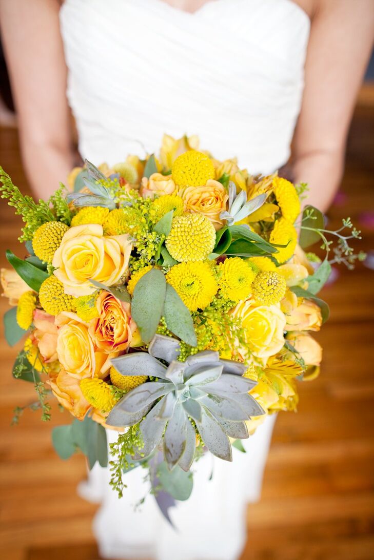 Allison carried a yellow bouquet made of garden roses, billy balls, seeded eucalyptus, alstroemerias, lilies, solidagos and succulents.