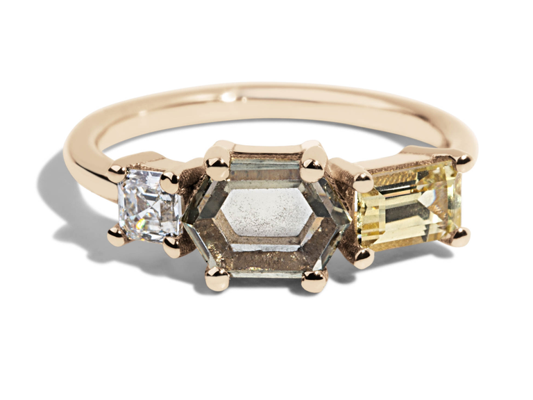 A hexagonal sapphire, a diamond, and a yellow sapphire.