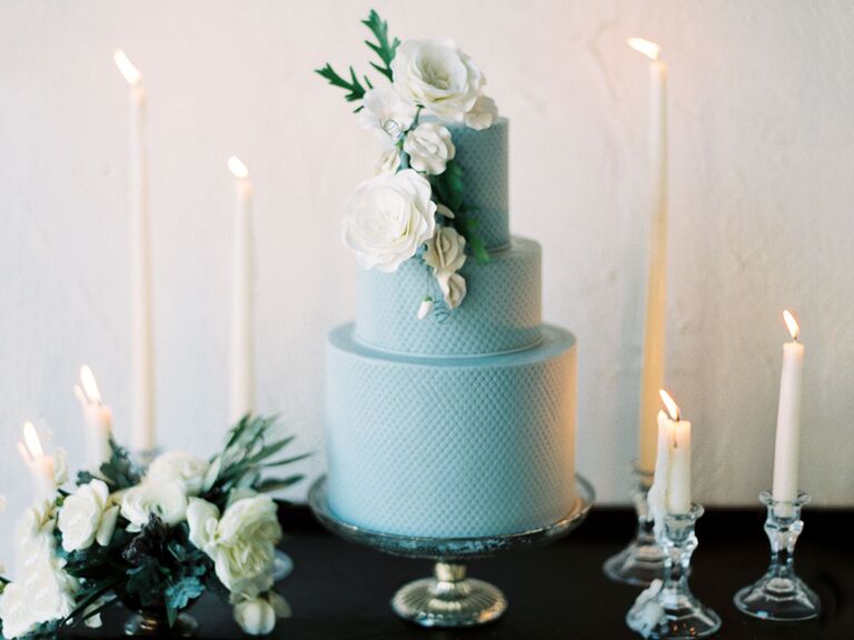 Blue cake with large white flower