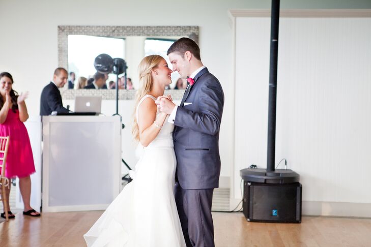 “Right after we said 'I do' and took pictures, our wedding coordinator took us up to the bridal suite. Two glasses of champagne were waiting along with a small plate of hors d'oeuvres from the cocktail hour,” Kelley says. “He told us to spend a few minutes together before we were introduced to our guests as 'Mr. and Mrs.' Jeff and I looked at each other and without saying a word, we knew what the other was thinking: 'We did it!’ ” After they were introduced, Kelley and Jeff started the night with their first dance. He wore a navy blue suit with a navy tuxedo and bright boutonniere, while she danced with him in a chic Augusta Jones wedding dress.