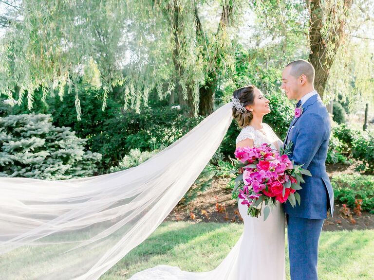 Couple embraces on their wedding day. 