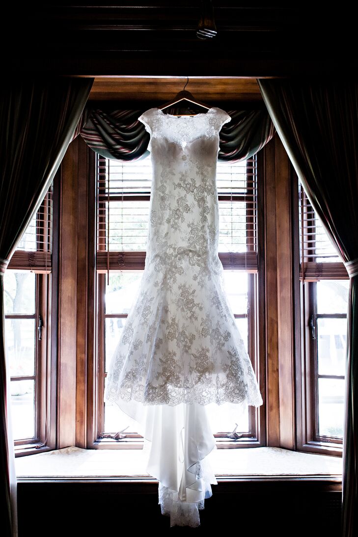 Laura wore a mermaid-fit, cap sleeve wedding dress with lace overlay for an elegant timeless feel. The neck and V-shaped back were slightly sheer to let the lace shine through.