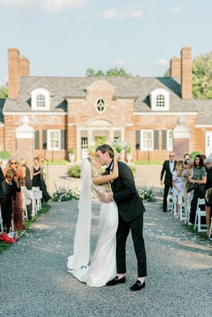 Bride in Long Veil, Sleek Dress Kissing Groom in Black Tux, Loafers On Ceremony Aisle at Recessional, Estate