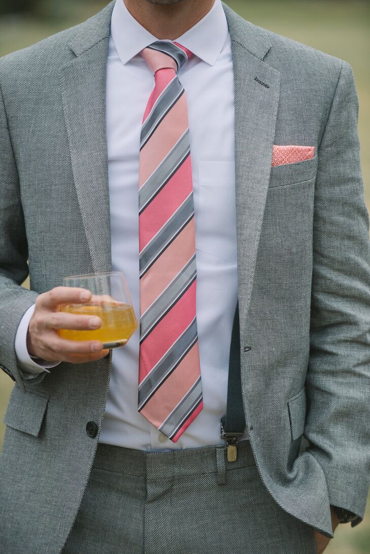 To complement the day's decor, Daniel wore a pink striped tie and pocket square with his light gray suit.