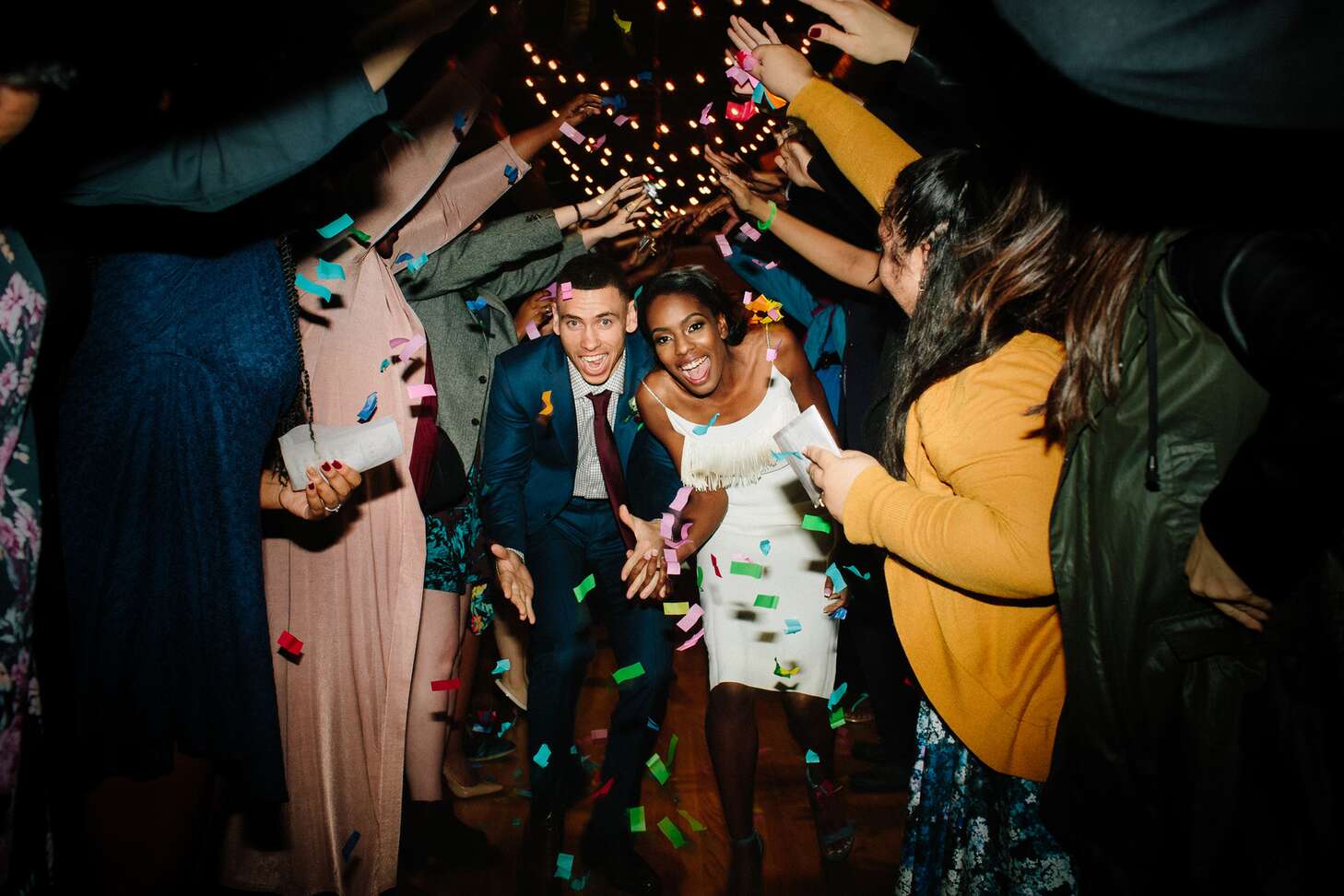 Newlyweds With Confetti at Their Wedding Celebration