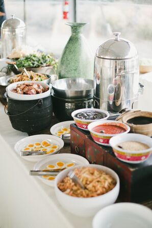 Buffet with White Dishes and Silver Flatware