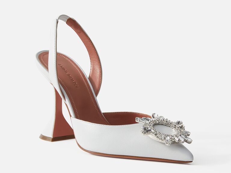 White sling back heels with crystal embellishment on the toe. 